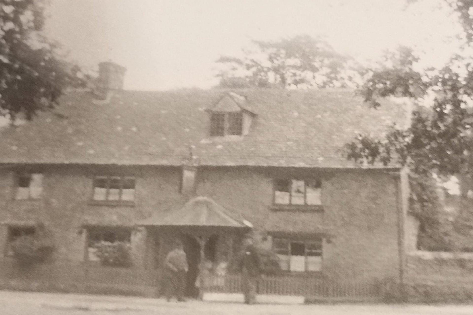 A vintage photograph of The Red Cow public house in Chesterton